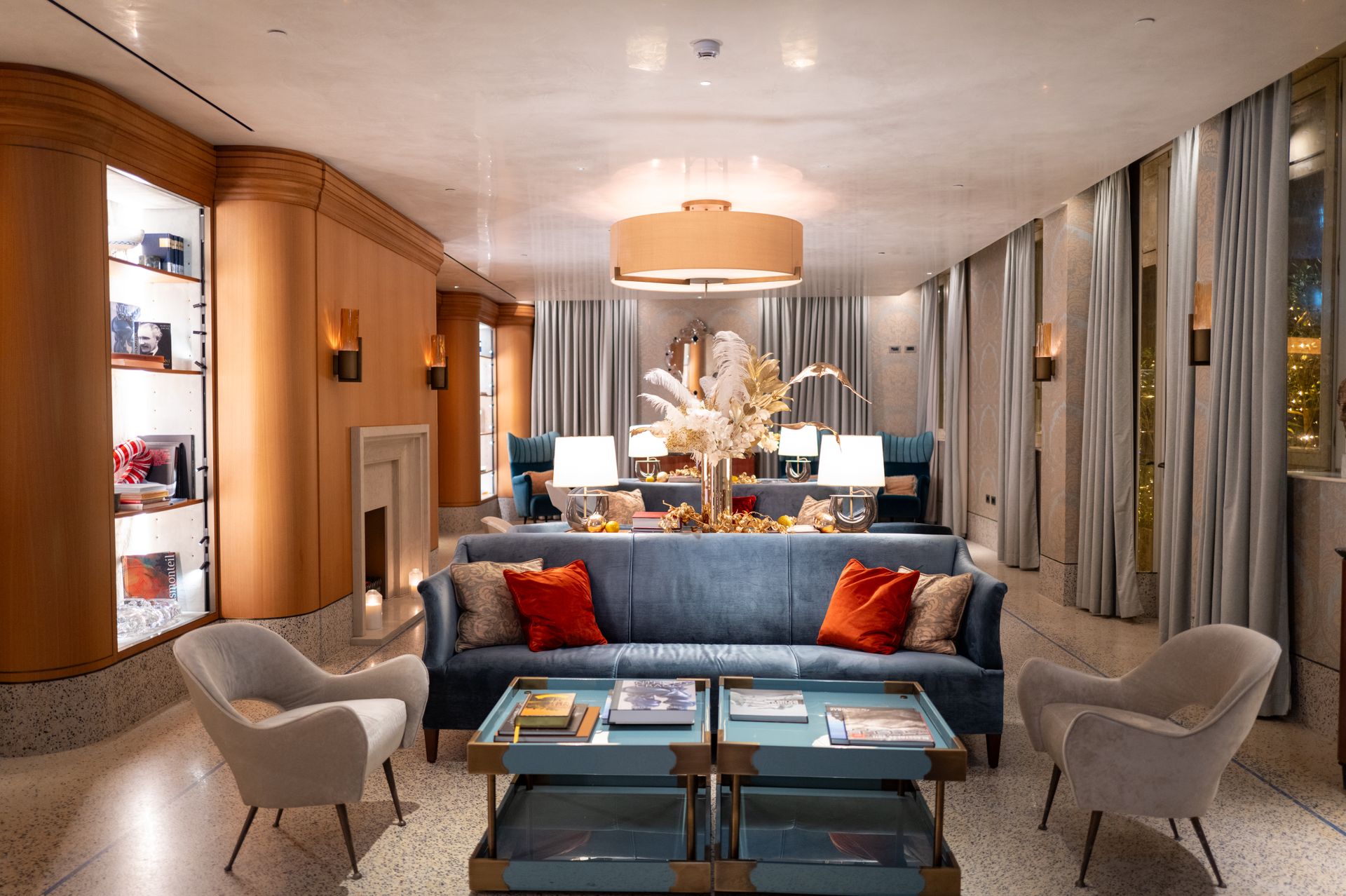 Opulent luxury living space with bespoke millwork, brass accents and designer furnishings