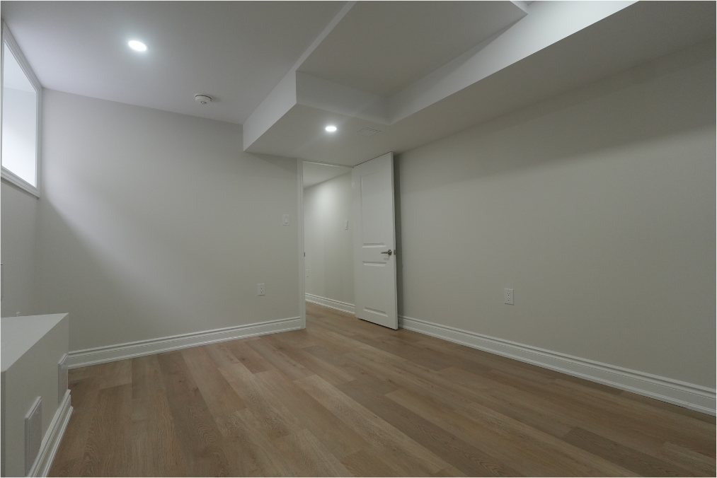 Open Basement Living by Eagle Eye Home Renovations