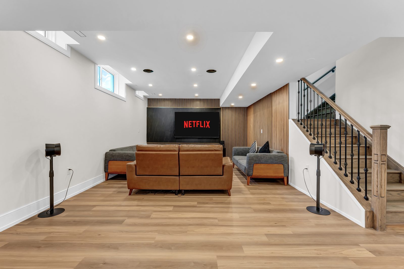 Basement Media Lounge by Eagle Eye Home Renovations
