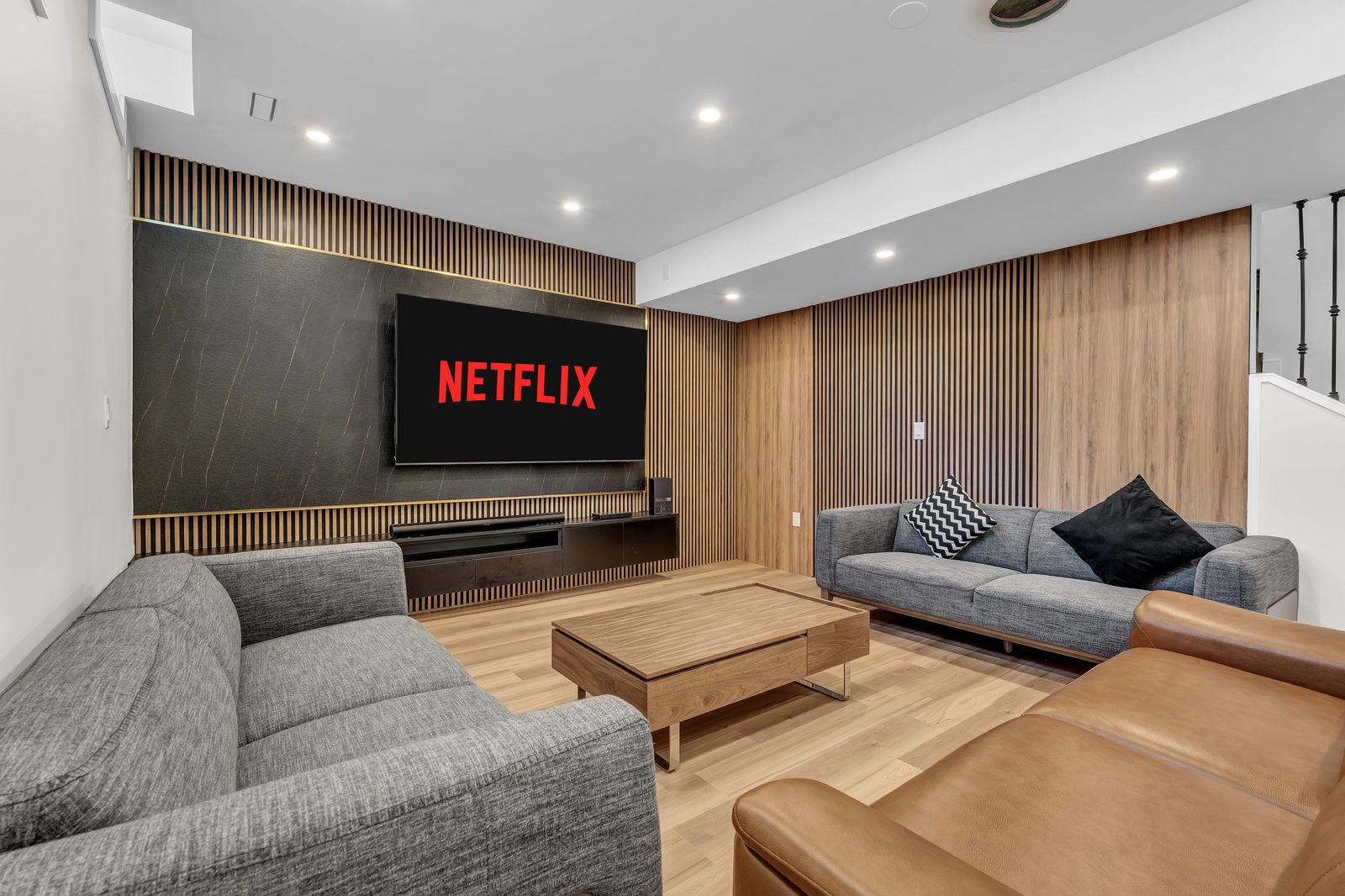 Basement Media Room by Eagle Eye Home Renovations