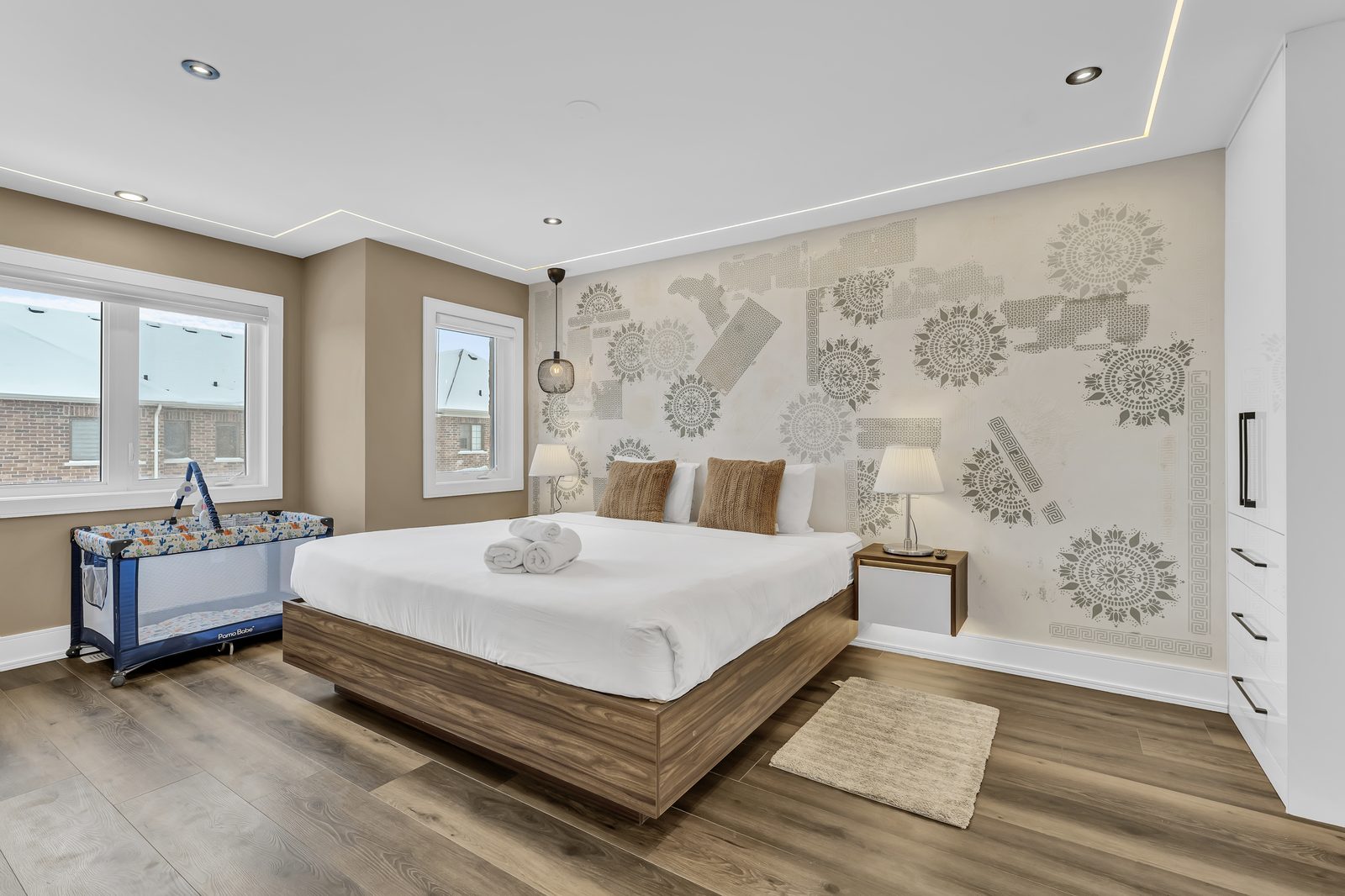 Master bedroom with Italian walls, ceiling strip lights and custom closets by Eagle Eye Home Renovations
