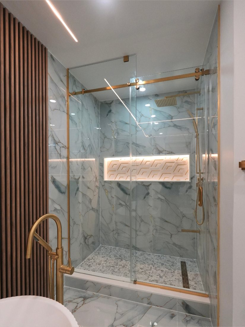 Gold-Accent Marble Shower by Eagle Eye Home Renovations