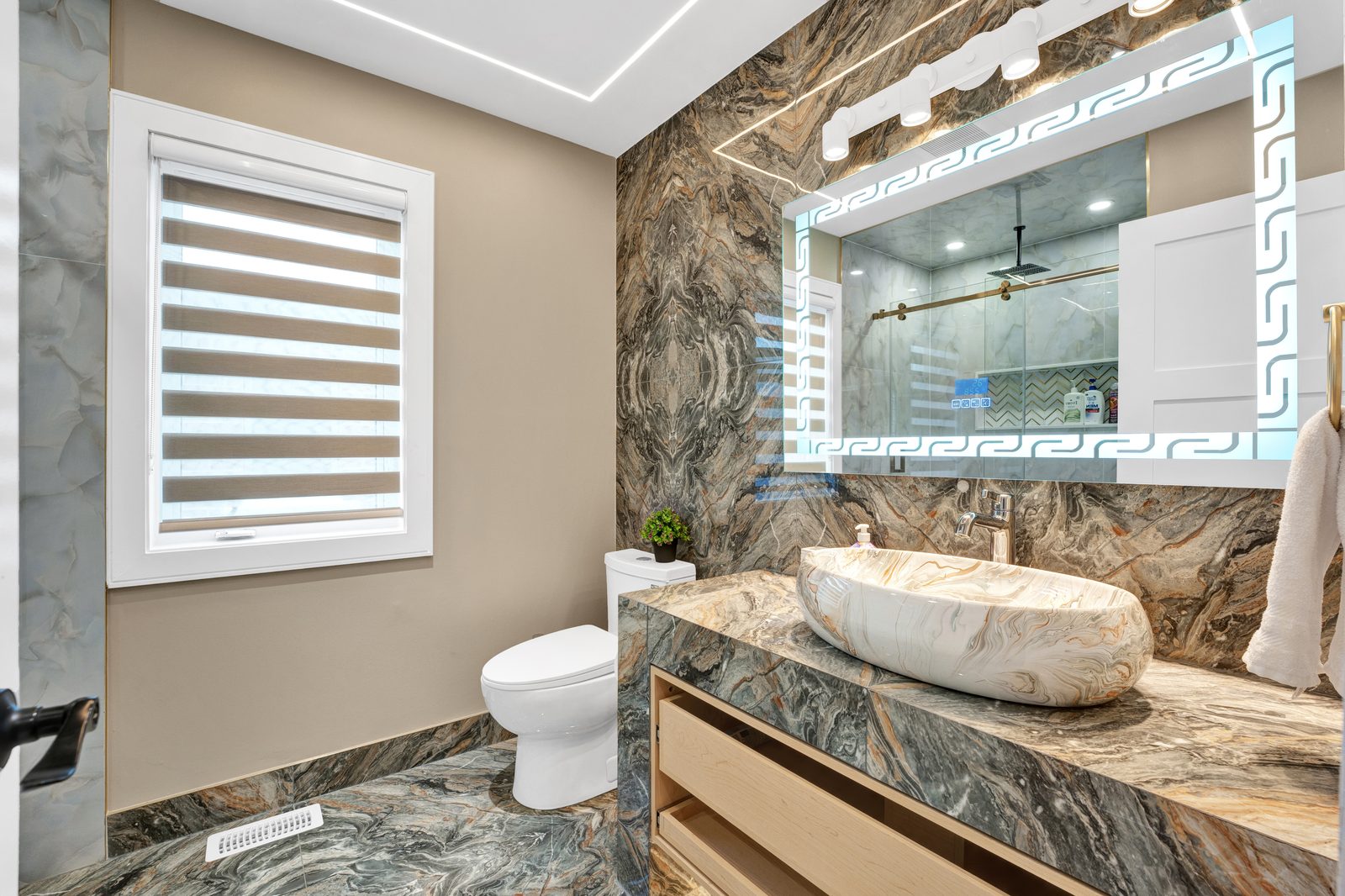 Washroom with LED mirrors, tiled walls and bowl sinks by Eagle Eye Home Renovations